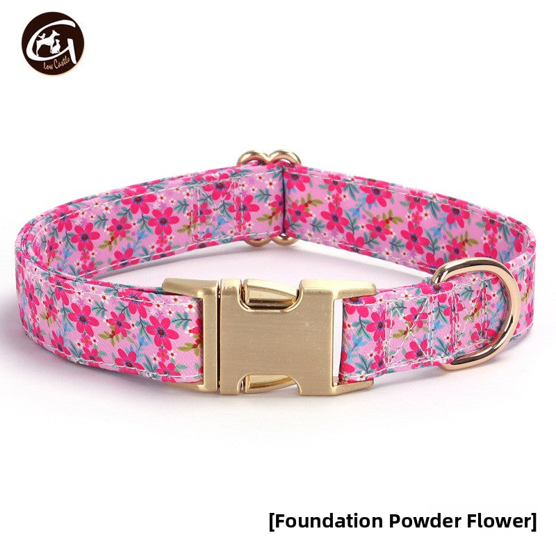 Floral fabric dog collar with gold buckle in Purple Floral Lead, front view