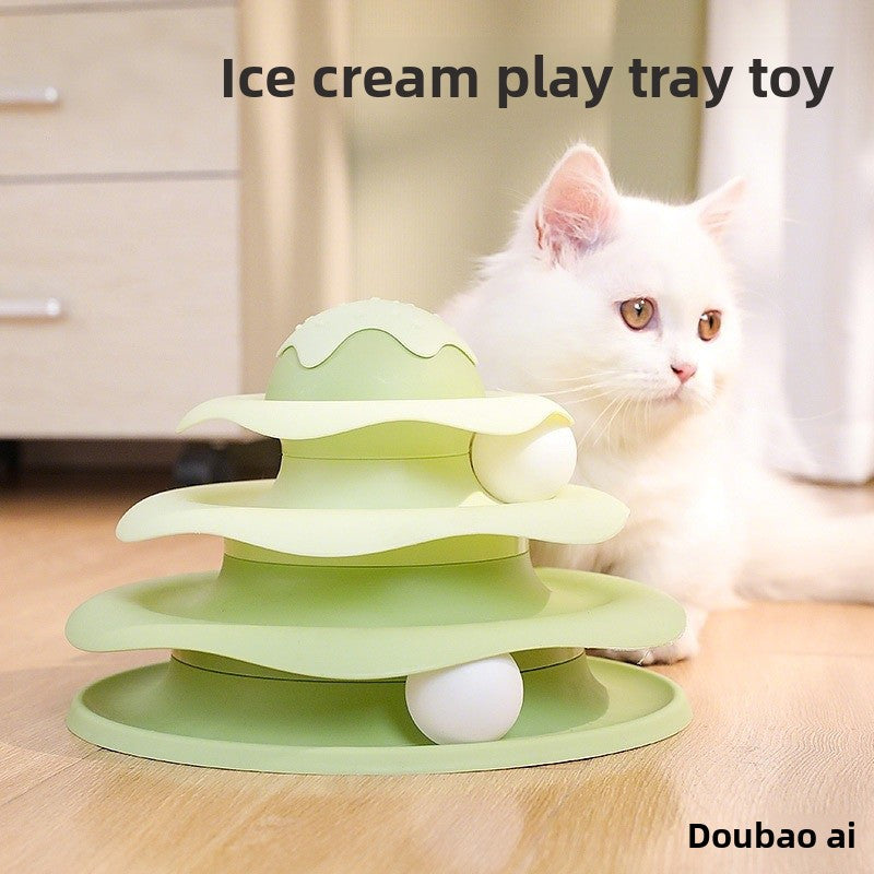 Kitten batting balls on a blue cat track toy