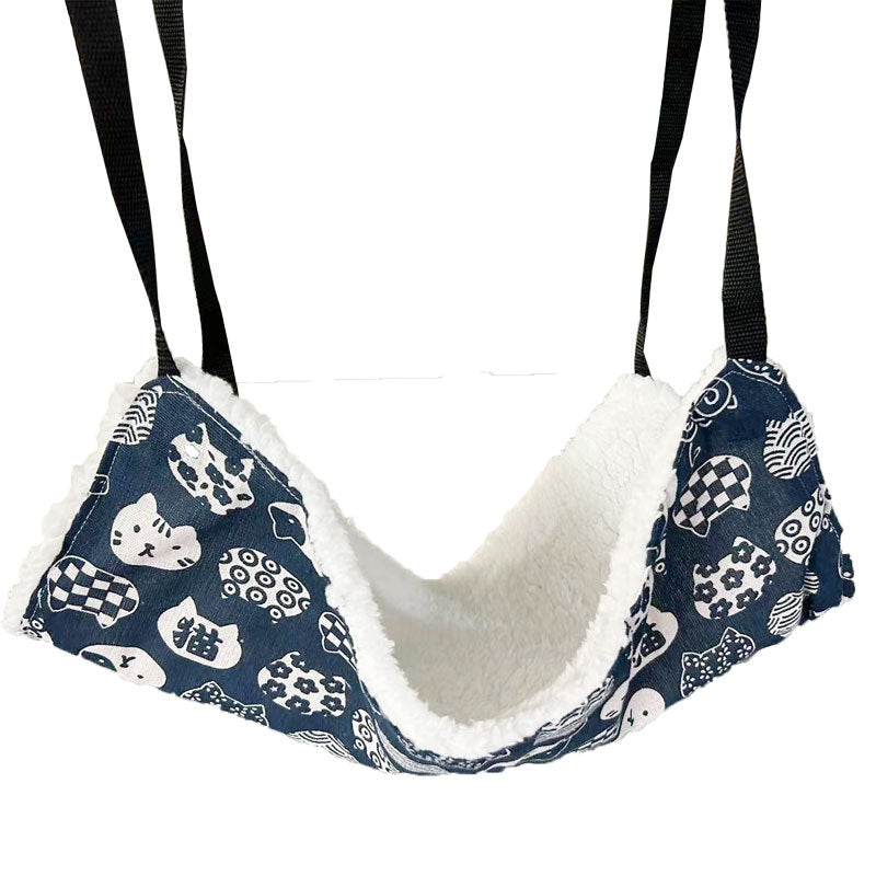 Blue cat print hanging hammock hooked inside a crate