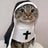Cat dressed in a gothic nun cloak costume