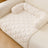 Light grey machine washable pet mat on a sofa