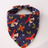 Small dog wearing a pretty floral print triangle pet bandana