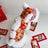 Hooded Tang suit New Year outfit for pets in Floral, in use with a pet