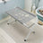 Foldable stainless steel pet bathing rack holding a dog in the bath