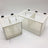 Mesh fish breeding isolation box with suction cups in aquarium, view 2