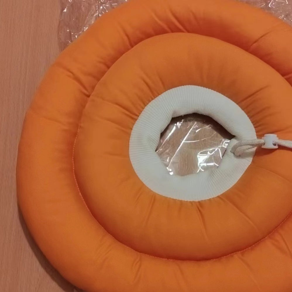 Soft padded recovery cone in light pink on a cat