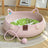 Cat lying in a woven rattan nest with green pad