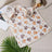Soft warm fleece blanket for small pets in Brown Multi Paw, close-up detail view