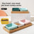 Square ceramic pet dishes on a raised bamboo feeding tray, view 1