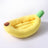 Kitten sleeping in a yellow banana cat bed with heart bone pillow