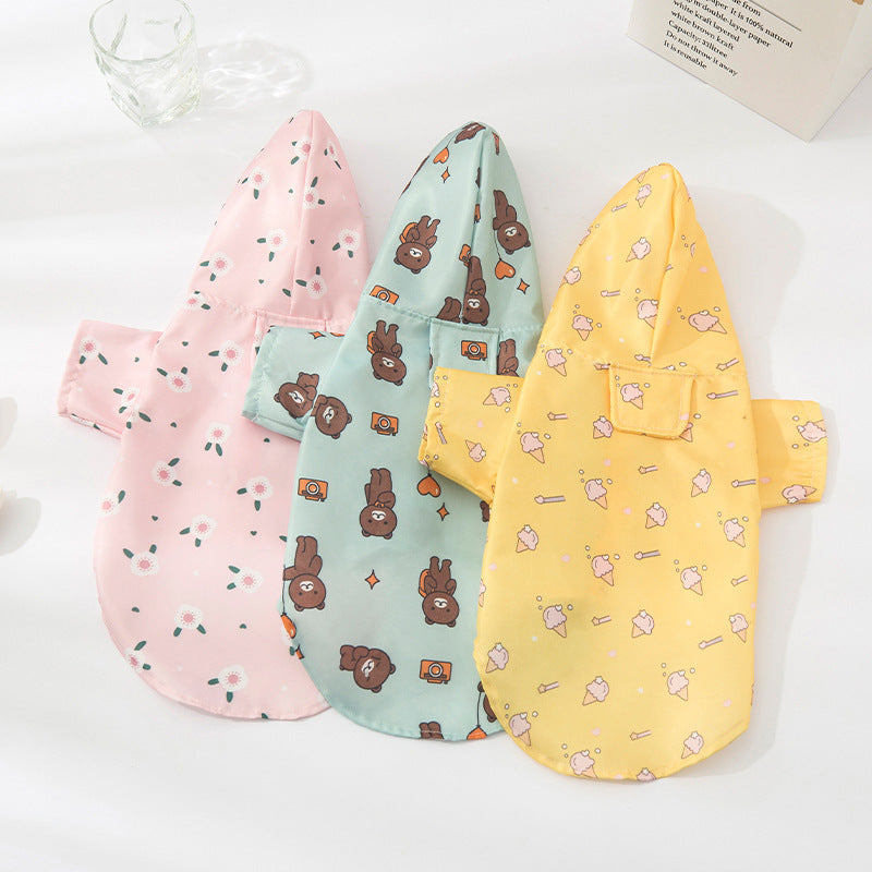 Waterproof dog raincoat with cartoon print in Travel Bear, front view