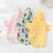 Waterproof dog raincoat with cartoon print in Travel Bear, front view