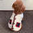 Christmas coral fleece pet vest with matching scarf, in a home setting