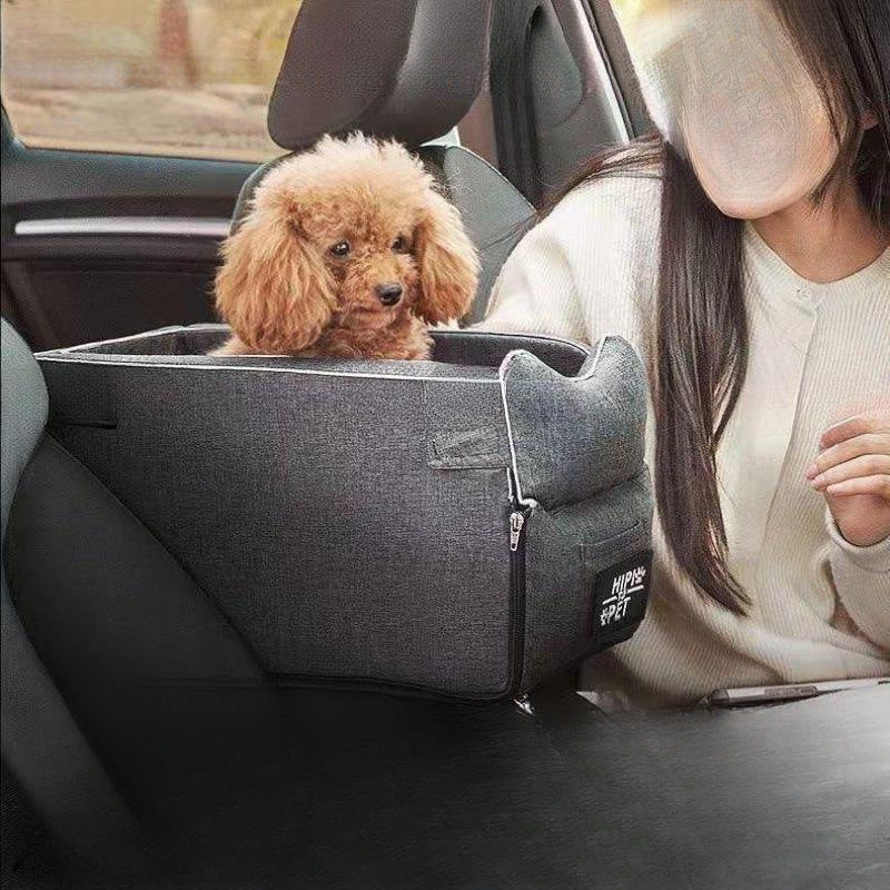 Small dog travelling in a portable car seat bed
