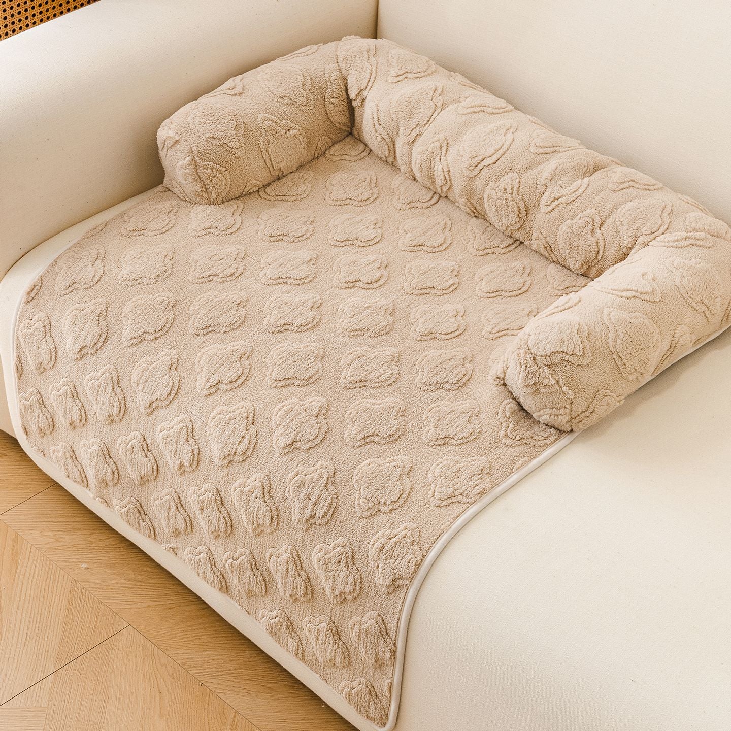 Light grey machine washable pet mat on a sofa