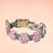 Handmade woven boho pet collar with pearl flowers in Pink and Green, front view