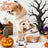 Small dog wearing a Halloween pumpkin and bat knit jumper
