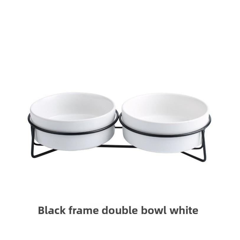 Raised glazed ceramic pet bowl on a stand in pastel yellow, view 16