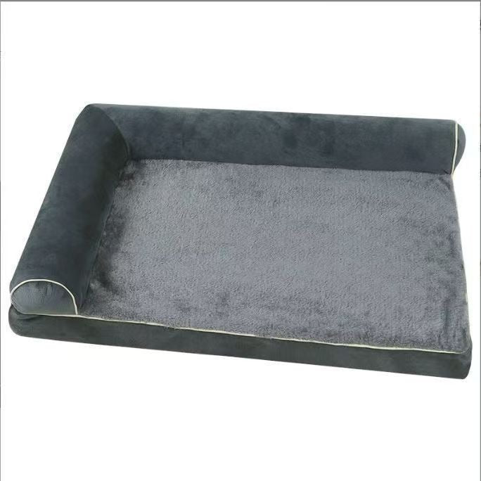 Dog resting on a dark grey plush pet bed