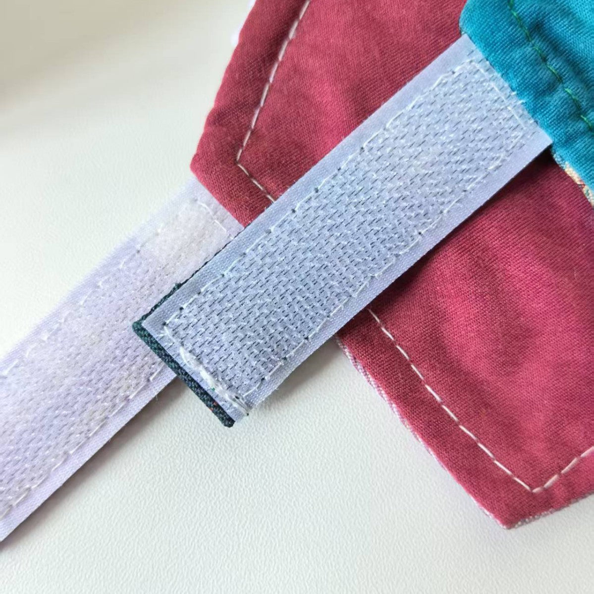 Checked cotton pet cape collar for dogs and cats in Blue, in a home setting