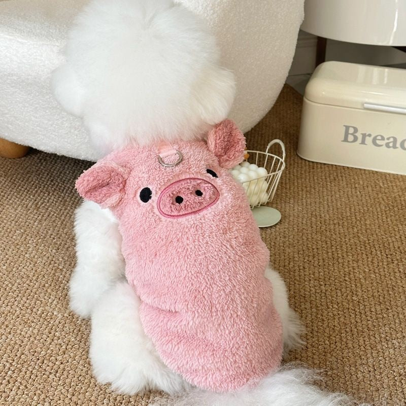 Small dog in a pink fleece lined jumper with piglet embroidery