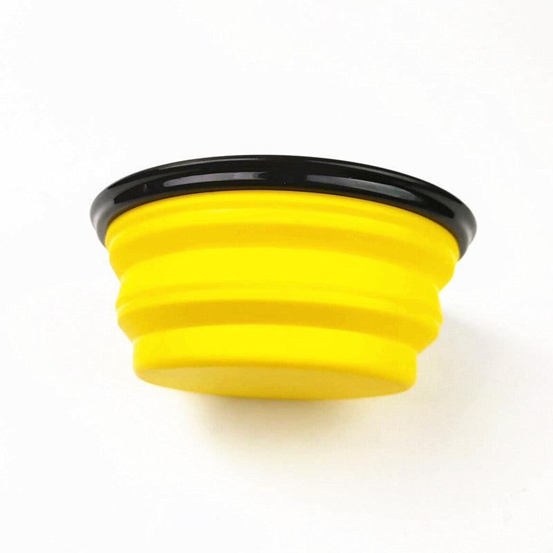 Collapsible silicone travel dog bowl in red folded flat