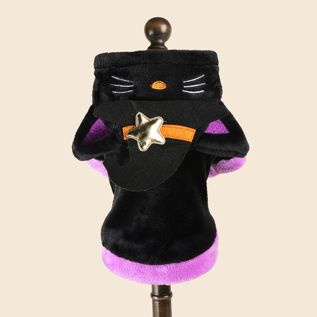 Cat wearing a pumpkin ghost Halloween costume with plaid detail