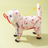 Small dog in a pink strawberry waterproof raincoat