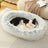 Raised edge cotton dog bed with curved sides and soft cushion