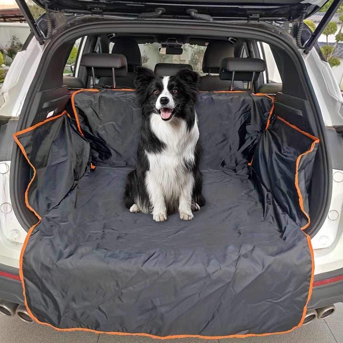Dog sitting on a black edge boot liner in the car