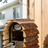 Wooden bird house with natural bark finish for gardens, view 1