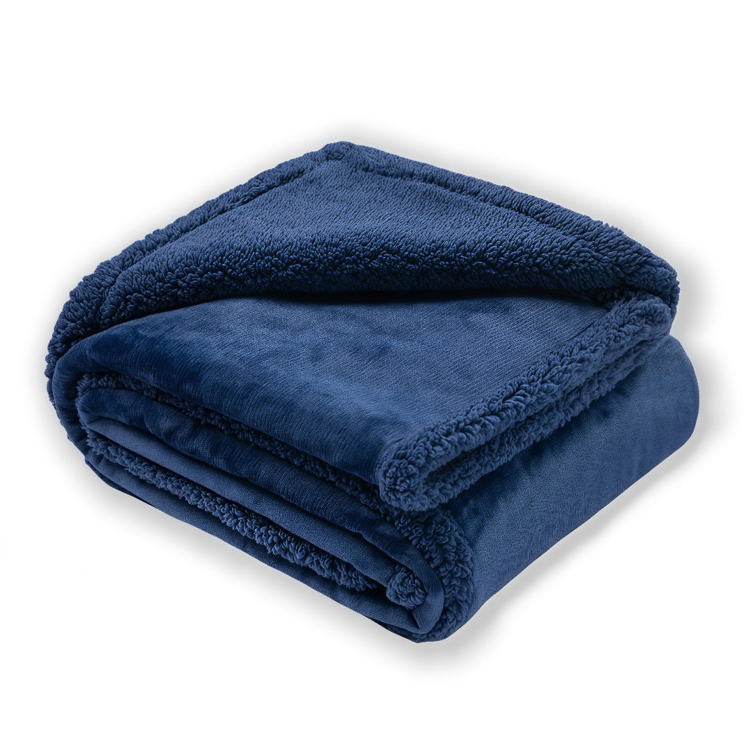 Waterproof double-sided pet blanket in grey on a sofa
