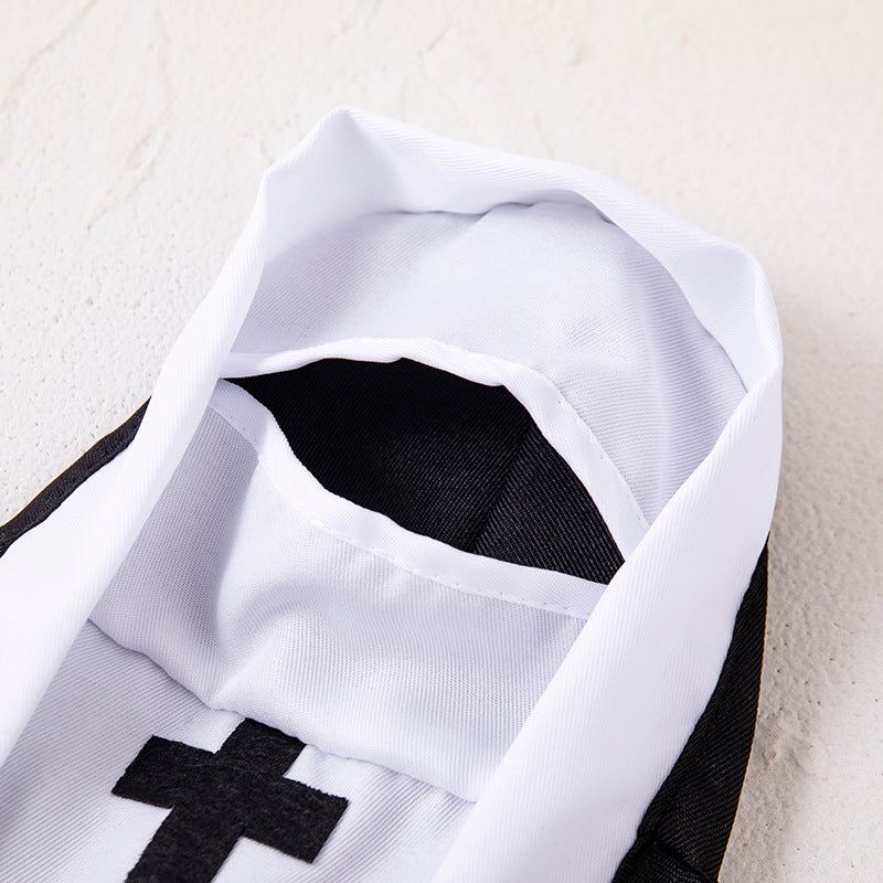 Cat dressed in a funny black and white nun costume