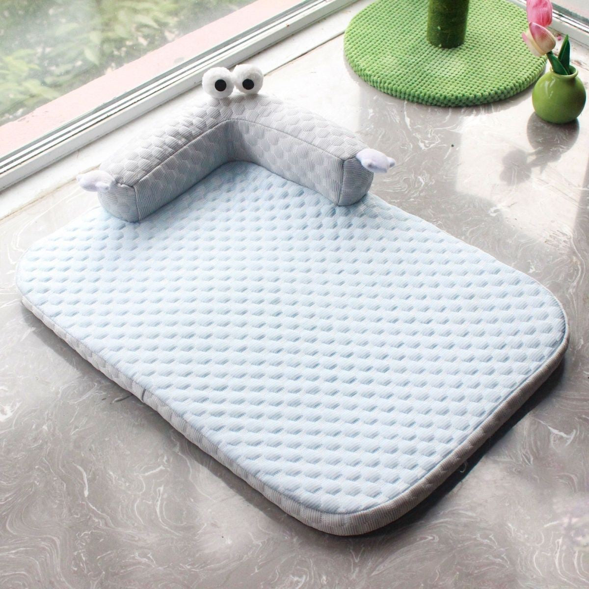 Dog resting on a washable cooling bed in large size
