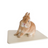 Hamster resting on an off white ceramic cooling tile