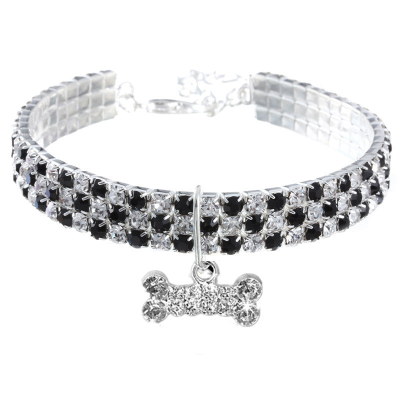 Three row rhinestone elastic collar in pink on a small dog
