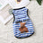 Small dog wearing a light blue striped summer vest