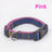 Soft red harness and lead on a small dog