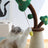 Vertical cat scratching post with a hanging carrot toy