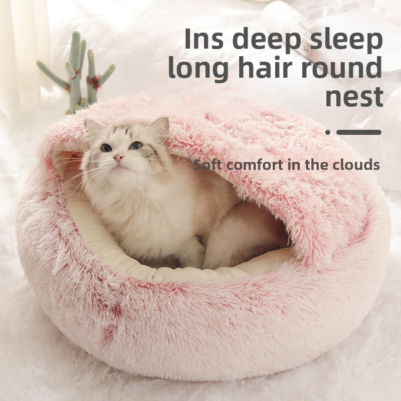 Cat resting in a charcoal grey velvet cat bed