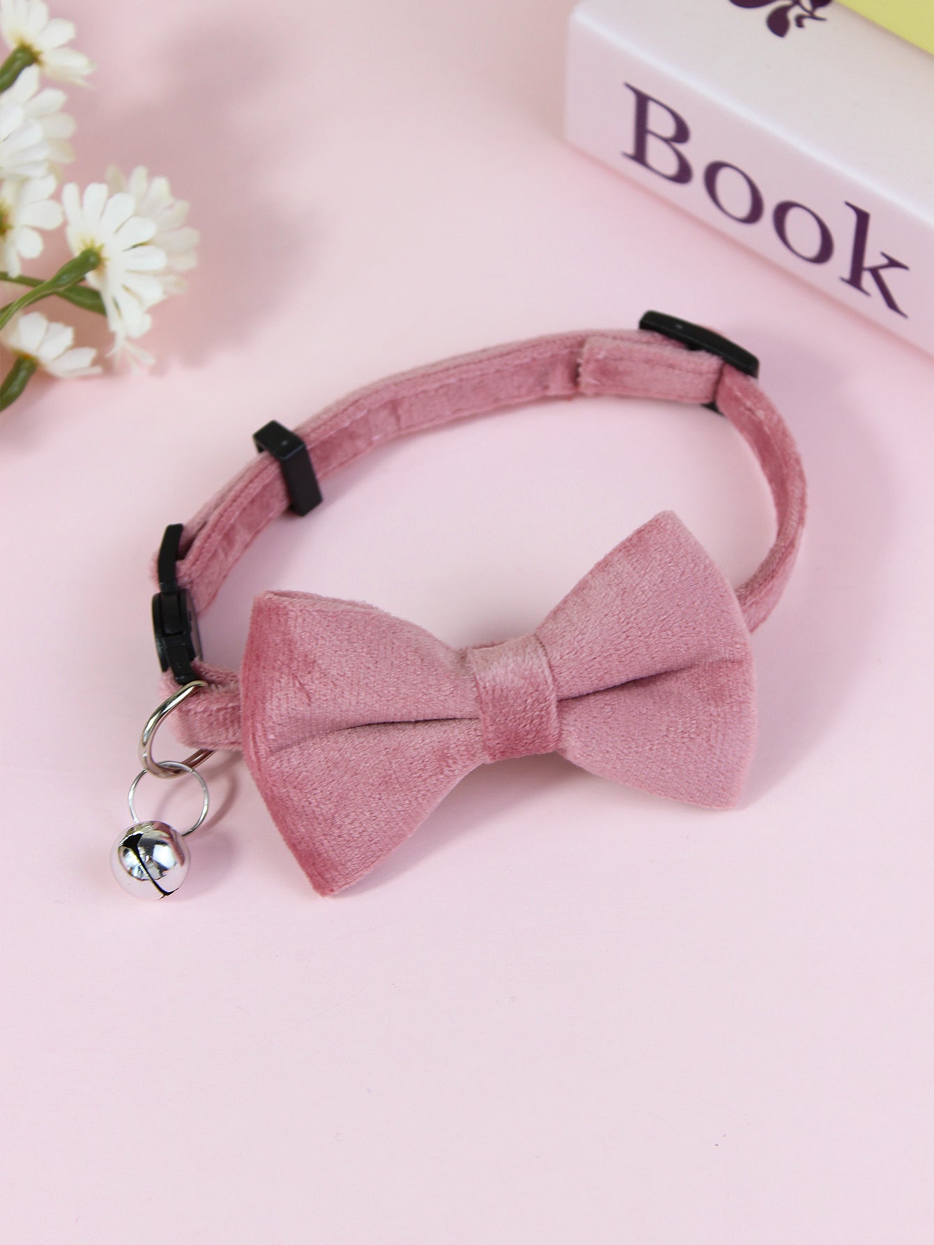 Striped cat collar with velvet bow, ideal for everyday use