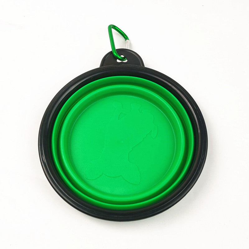 Blue portable folding pet bowl filled with water on a walk