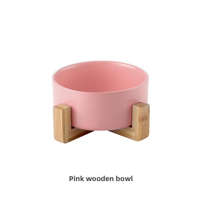 Ceramic cat bowl on a raised wooden stand in white