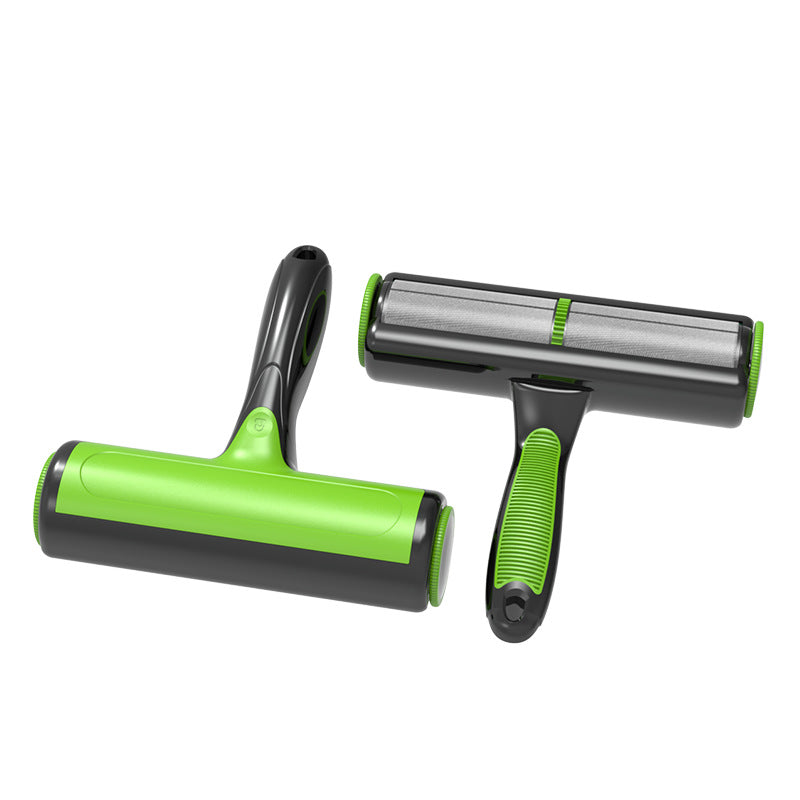 Grey and white lint brush lifting cat fur from a sofa