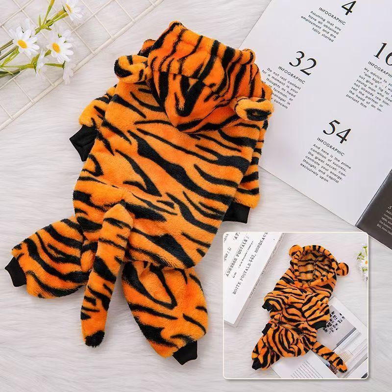 Small dog dressed as a cute yellow tiger