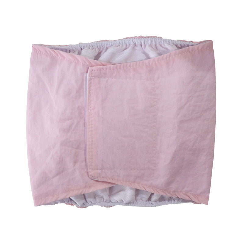 Reusable dog hygiene pants with hook and loop fastening, in use with a pet