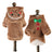 Small dog dressed in a plush gingerbread man costume