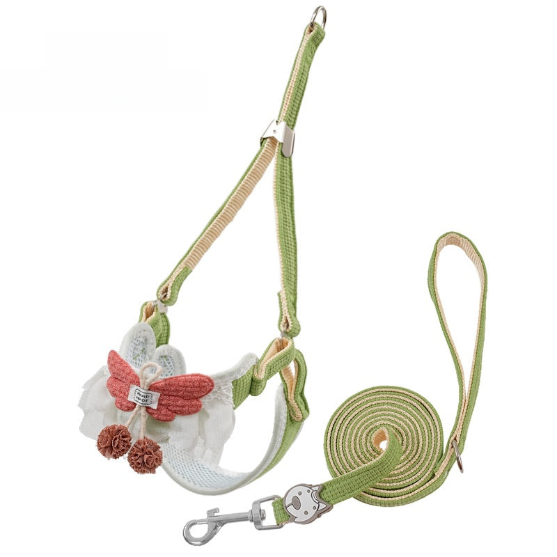 Floral vest harness and lead set in pink on a small dog