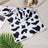 Small coral fleece pet mat in Black Bone and Paw, full product photo