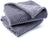 Dusty pink soft pet throw on a sofa